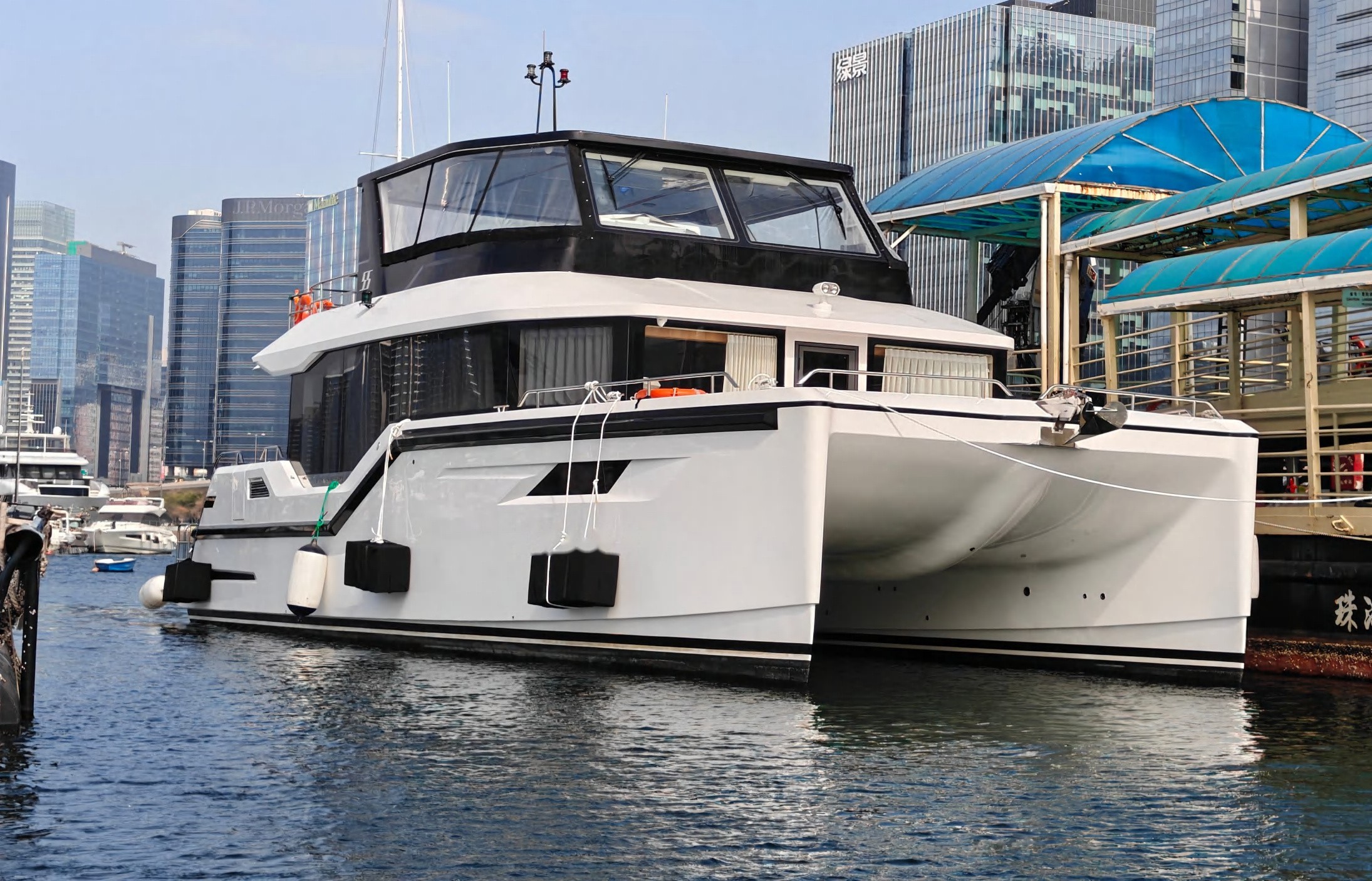 OBLUE 55 carbon fiber catamaran bows at the dock
