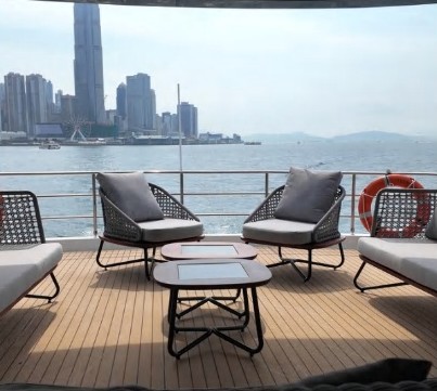 Aft-deck terrace of the OBLUE 55 overlooking Victoria Harbour